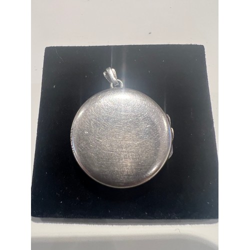 93 - silver locket , stamped silver round locket engraved floral design , opens for photos 21.5mm , 4 gra... 
