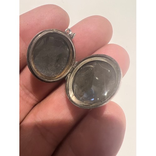 93 - silver locket , stamped silver round locket engraved floral design , opens for photos 21.5mm , 4 gra... 
