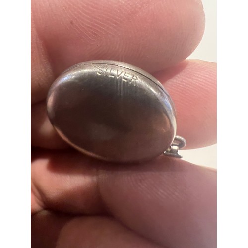 93 - silver locket , stamped silver round locket engraved floral design , opens for photos 21.5mm , 4 gra... 