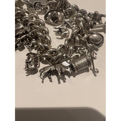 98 - vintage silver charm bracelet with 20 charms , teddy bear , hat , dog , stagg , newt , bull , tankar... 