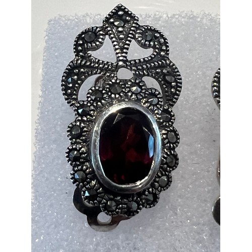 106 - Marcasite earrings with oval red garnet stone in centre , stamped 925 21.4mm x 12.6mm