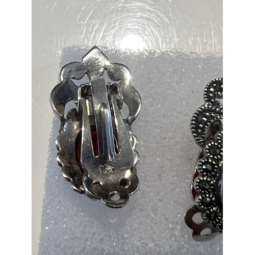 106 - Marcasite earrings with oval red garnet stone in centre , stamped 925 21.4mm x 12.6mm