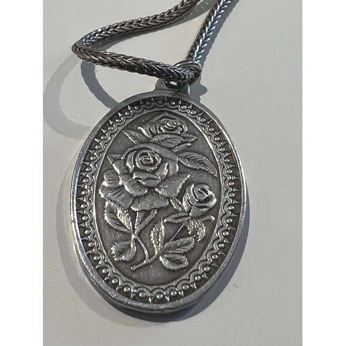 118 - Silver necklace & pendant bye Franklin Mint. 15” inch chain with a oval pendant floral engraved ... 