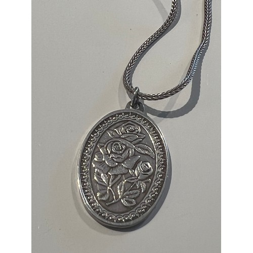 118 - Silver necklace & pendant bye Franklin Mint. 15” inch chain with a oval pendant floral engraved ... 