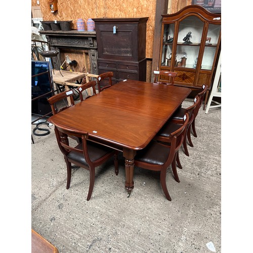 21 - Mahogany William IV table on brass casters plus 8 chairs