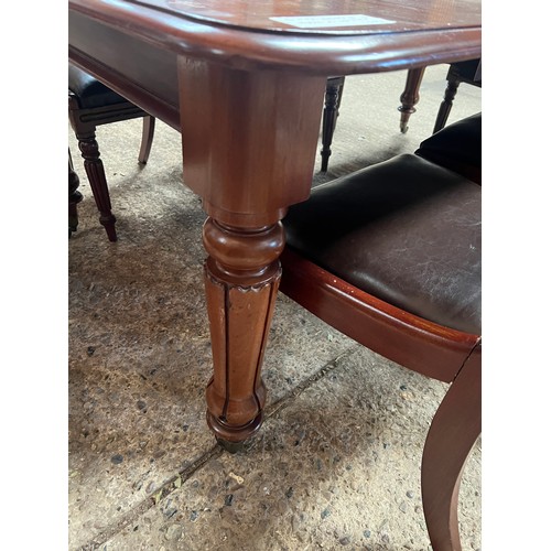 21 - Mahogany William IV table on brass casters plus 8 chairs