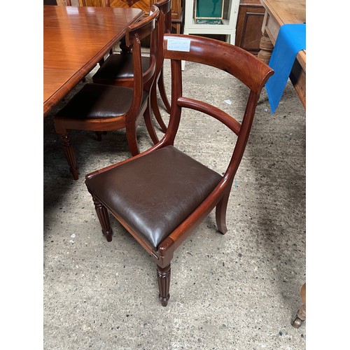 21 - Mahogany William IV table on brass casters plus 8 chairs