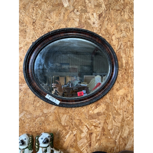 28 - oval wood framed mirror