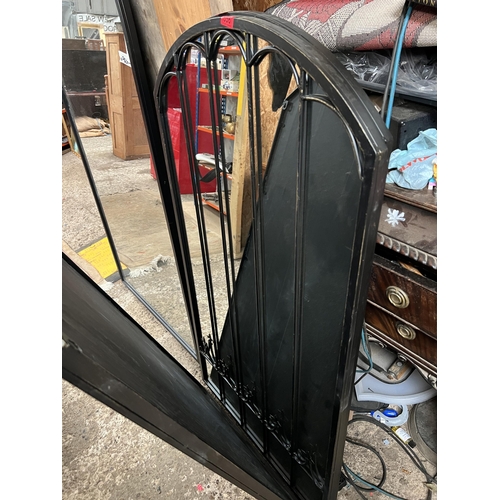 556 - black framed arch top mirror...