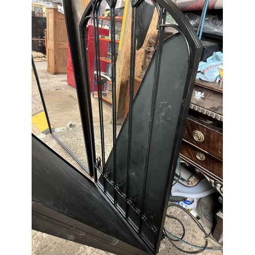 557 - black framed arch top mirror...