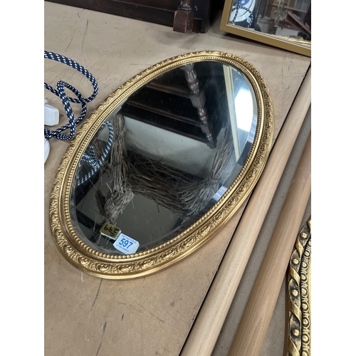 597 - oval gold framed mirror