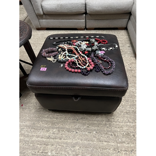 475 - brown leather storage footstool