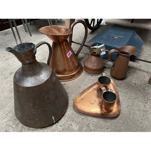 484 - Qty copper jugs