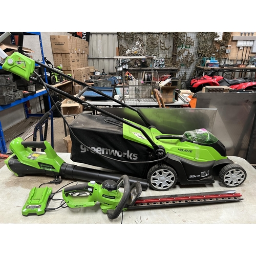 164 - Greenworks cordless set mower , hedge cutter , blower with battery / charger