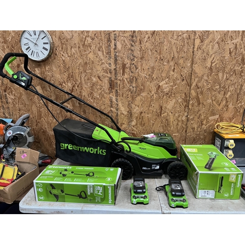 27 - Greenworks cordless set , Lawn mower , strimmer / blower with batteries / charger
