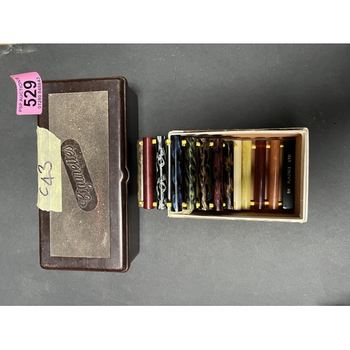 529 - Bakerlite cigarette box , plus plastic salesman sample