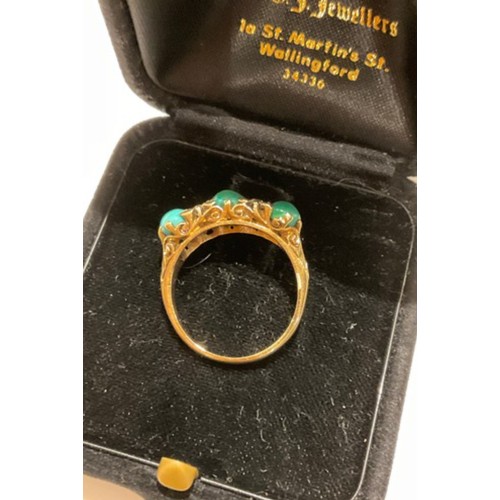 11 - 18ct gold ring with 4 Diamonds & 3 oval different shade turquoise green stones with a filigree m... 