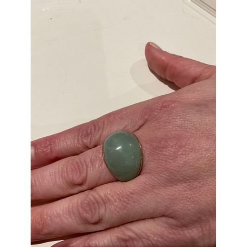 21 - 9ct gold & jade cocktail ring, hallmarked / stamped 9ct , domed shaped ring with , good side 34.... 