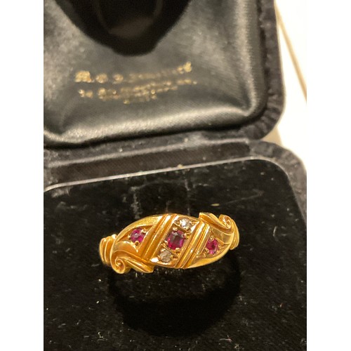 23 - 18ct gold and Ruby / diamond ring , full English hallmarks , makers stamp E&W , head of ring 28.... 