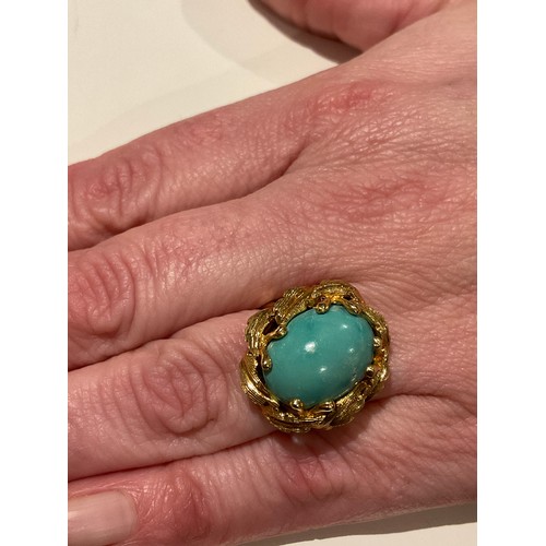 24 - 18ct gold & turquoise polished stone , with a leaf design mount around the large centre stone , ... 