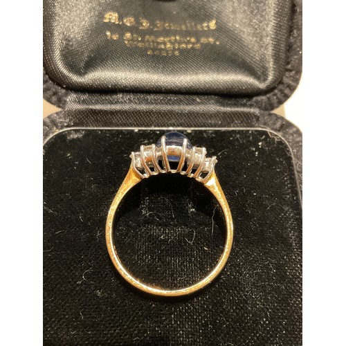 27 - 18ct gold Diamond / caversham Sapphire , dazzling diamonds 3 either side of a centre blue domed sapp... 