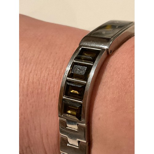 43 - DNKY ladies watch , chrome base metal with brown face , with brown Quartz stones on strap , face 39.... 