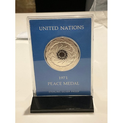 48 - Sterling silver proof UNITED NATIONS 1971 PEACE MEDAL in sealed case with display stand , with paper... 