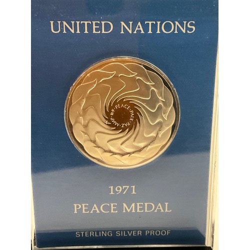 48 - Sterling silver proof UNITED NATIONS 1971 PEACE MEDAL in sealed case with display stand , with paper... 