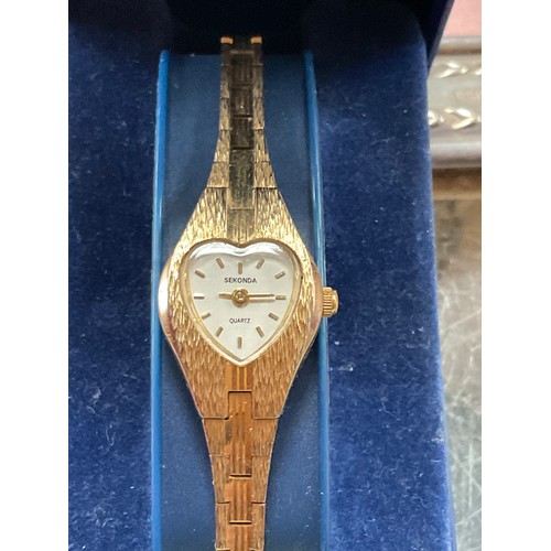 22 - Sekonda ladies watch , heart shaped face , gold tone , in original case with extra strap link . Quar...