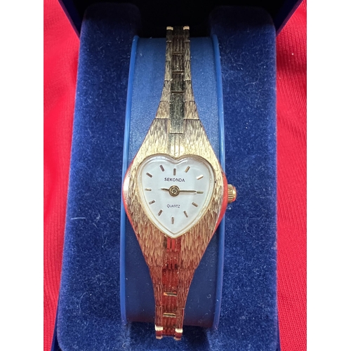 22 - Sekonda ladies watch , heart shaped face , gold tone , in original case with extra strap link . Quar...