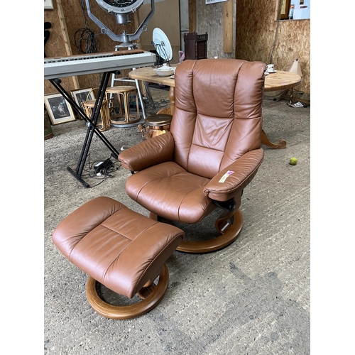 406 - EKORNES STRESSLESS recliner swivel chair & foot stool , tan brown leather