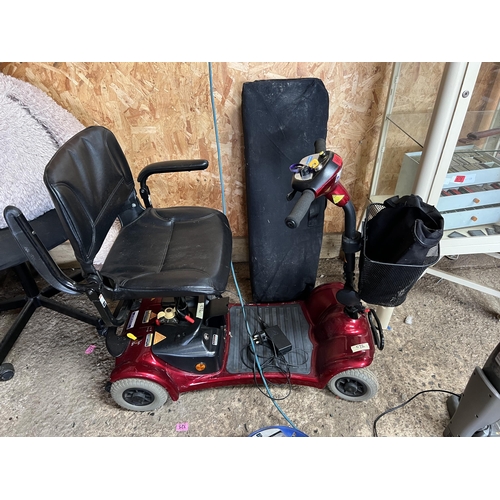 669 - Mobility scooter with charger & ramp working order