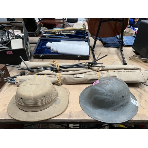 647 - 2 x army camp beds plus , 2 x helmets