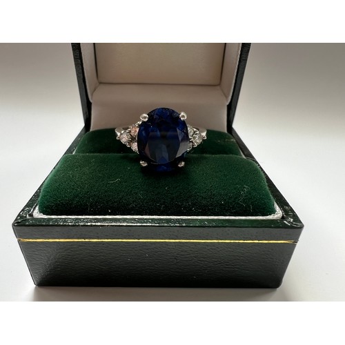 36 - Platinum Sapphire & Diamond ring , large blue sapphire centre stone with 3 diamonds both sides s... 