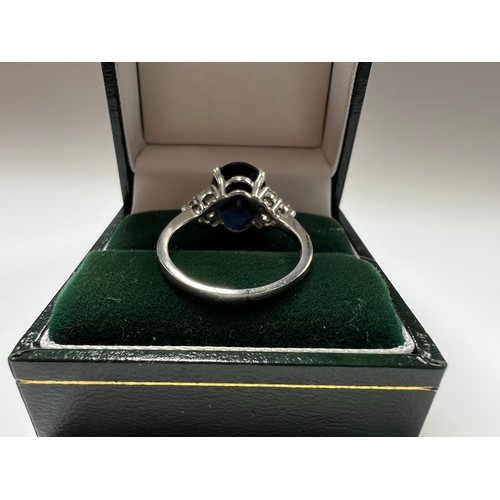 36 - Platinum Sapphire & Diamond ring , large blue sapphire centre stone with 3 diamonds both sides s... 