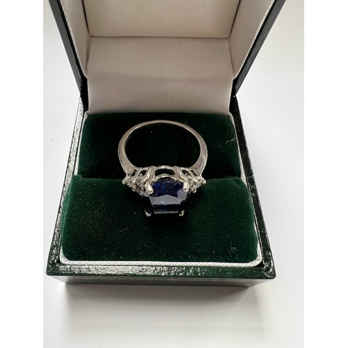 36 - Platinum Sapphire & Diamond ring , large blue sapphire centre stone with 3 diamonds both sides s... 