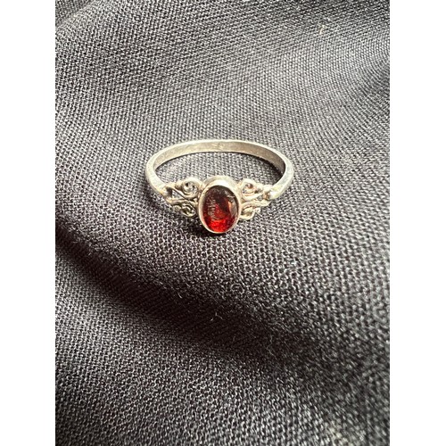 676 - Silver ring with red garnet stone