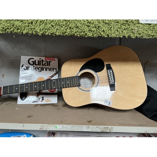 483 - Acoustic guitar with bag / book