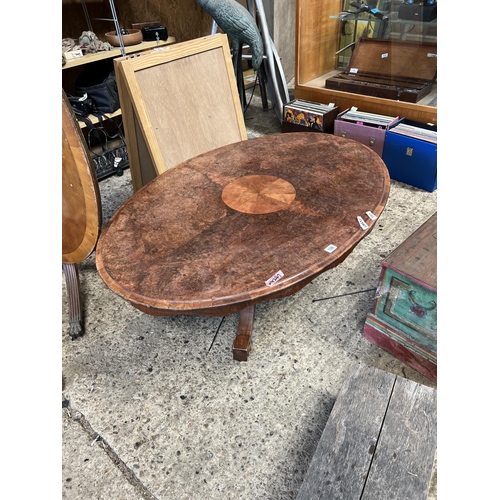 108 - Oval table on casters ornate carved legs