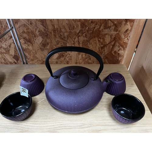 66 - Metal oriental tea pot and cups