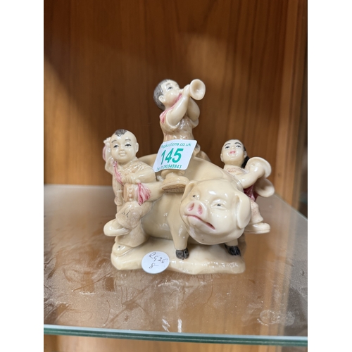 145 - Signed soapstone figure