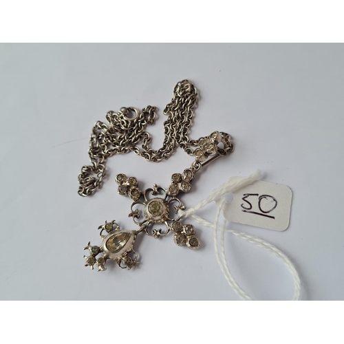 50 - An antique silver paste set pendant on a silver chain