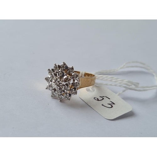 53 - A vintage diamond star burst ring in 9ct - size M - 3.84gms