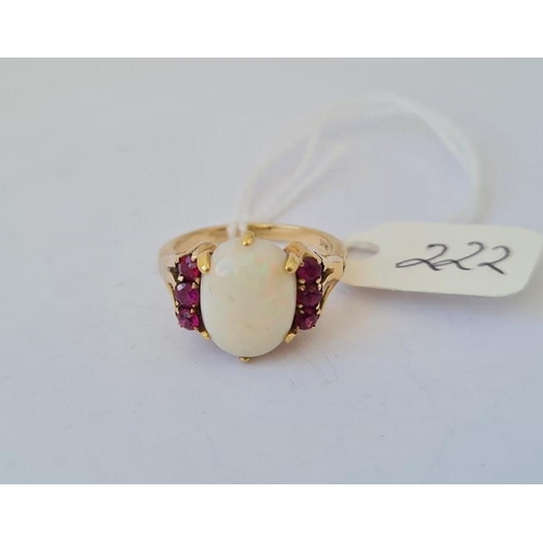 222 - An opal and ruby 18ct gold dress ring size J 4.8g inc