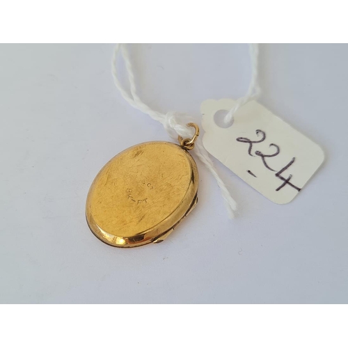 224 - 9ct back and front locket