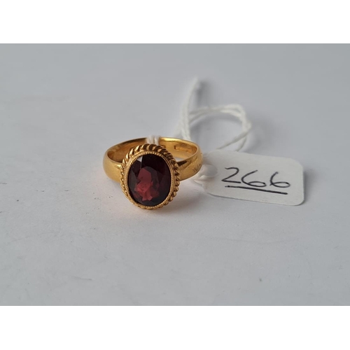 266 - AN EDWARDIAN GARNET RING IN 22CT GOLD - size N - 6.6gms