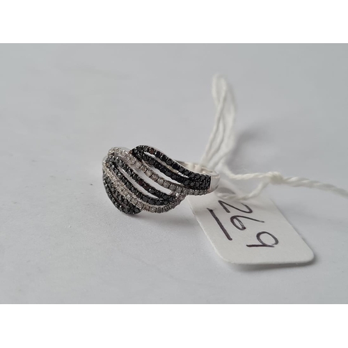269 - A vintage two colour diamond 8 row ring in 9ct - size J