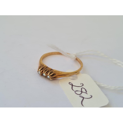 282 - A three stone seed pearl set ring in 14ct gold size P 2.4g