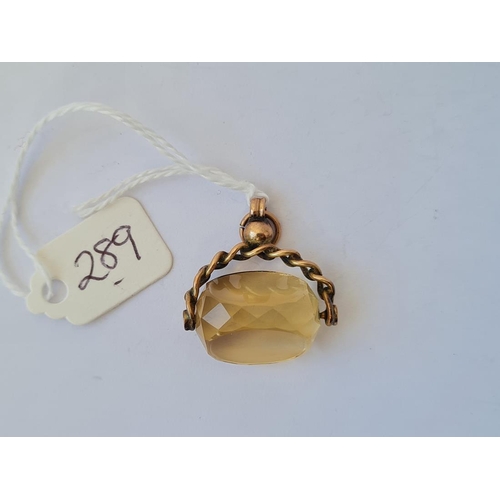 289 - A stone set 9ct spinning fob