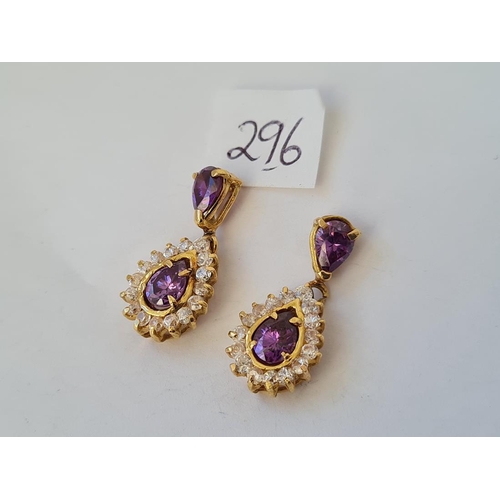 296 - A pair of stone set pear drop earrings in 9ct settings 6.7g